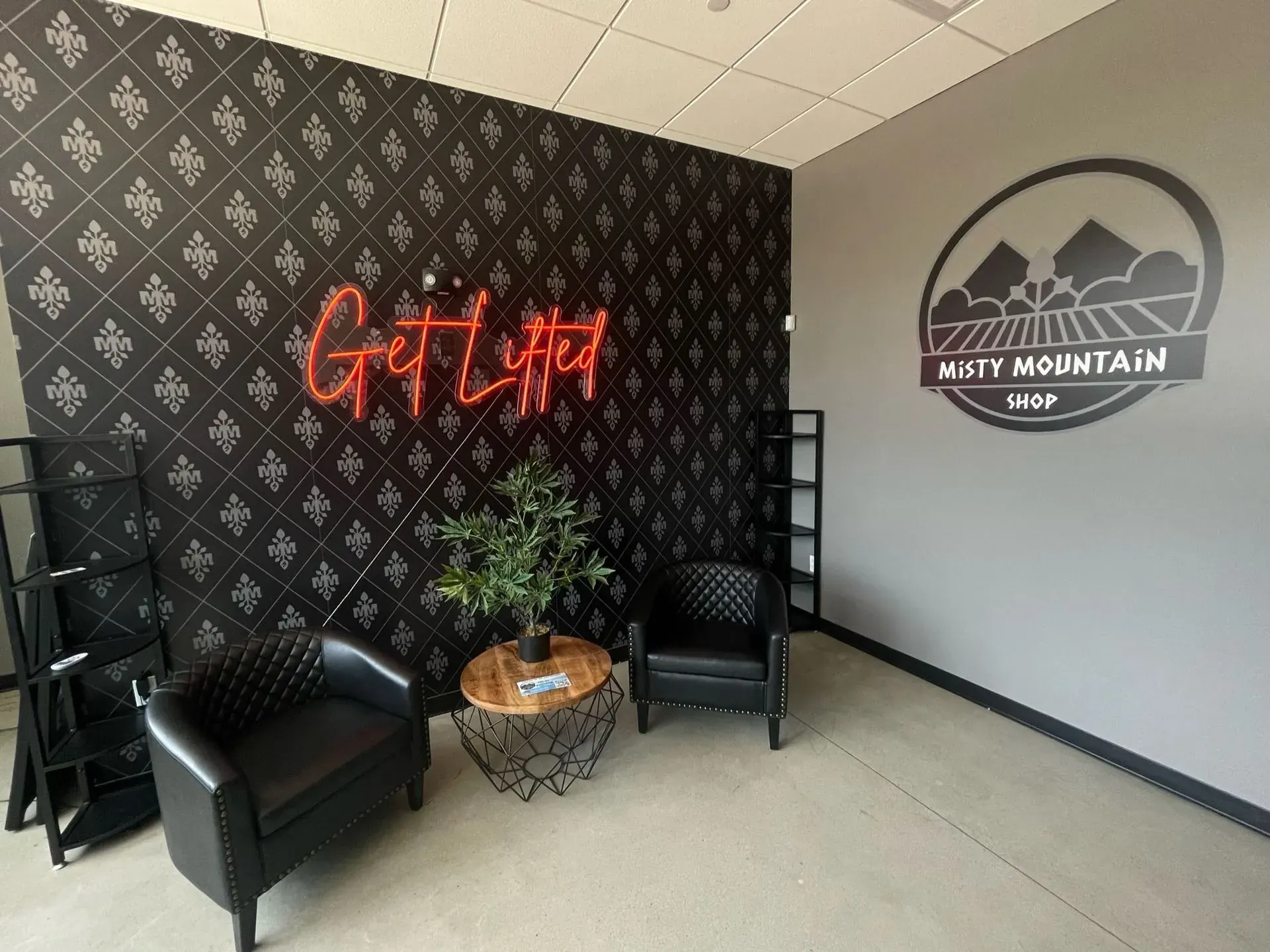 Retail lobby with a neon sign and a lit logo wall