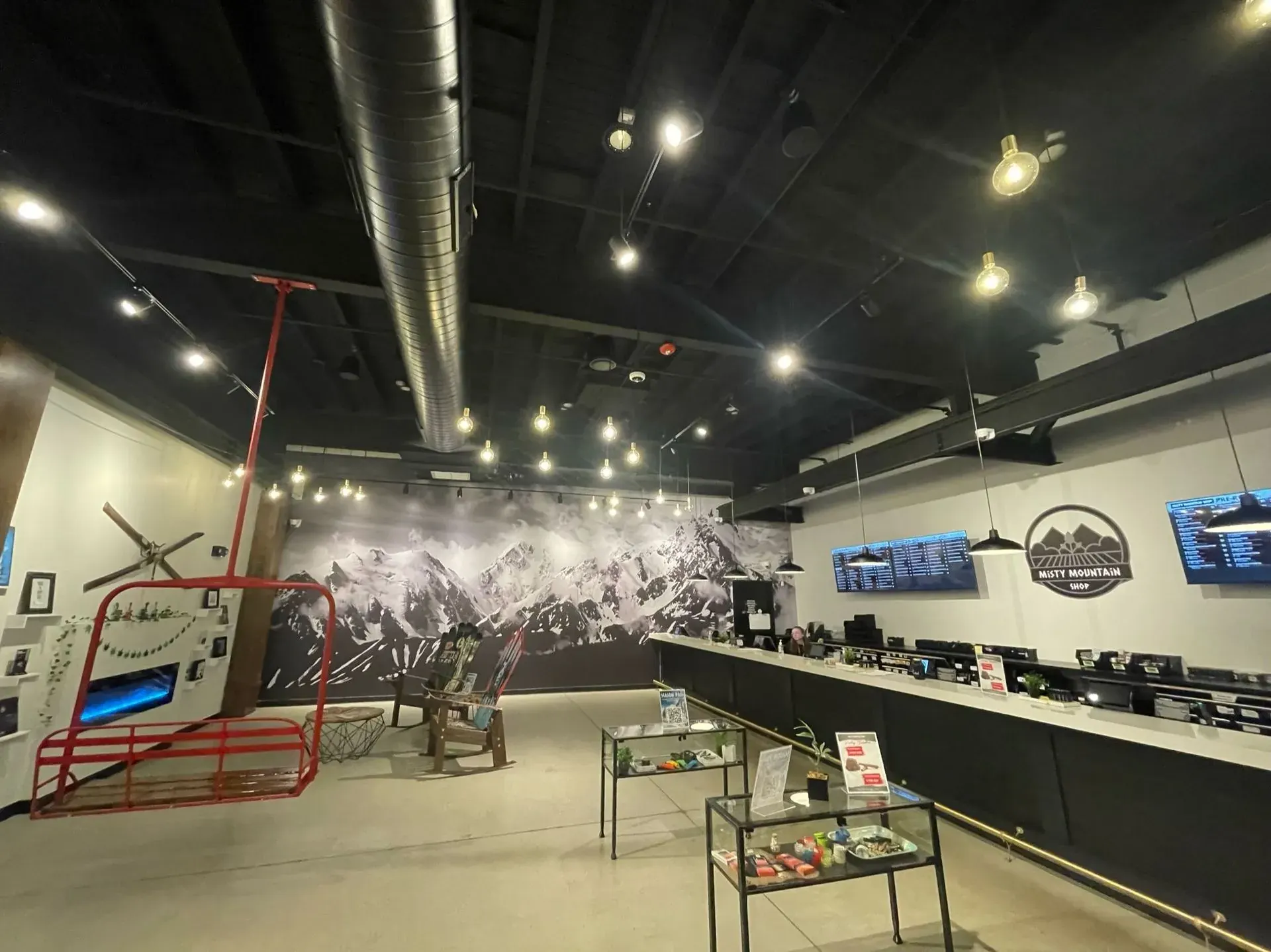 Retail showroom with an exposed ceiling and hanging pendants