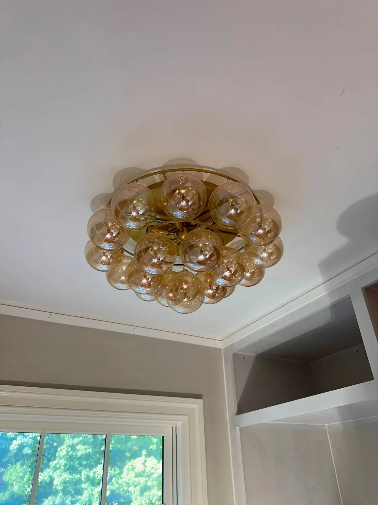 Amber glass flush-mount fixture on a white ceiling