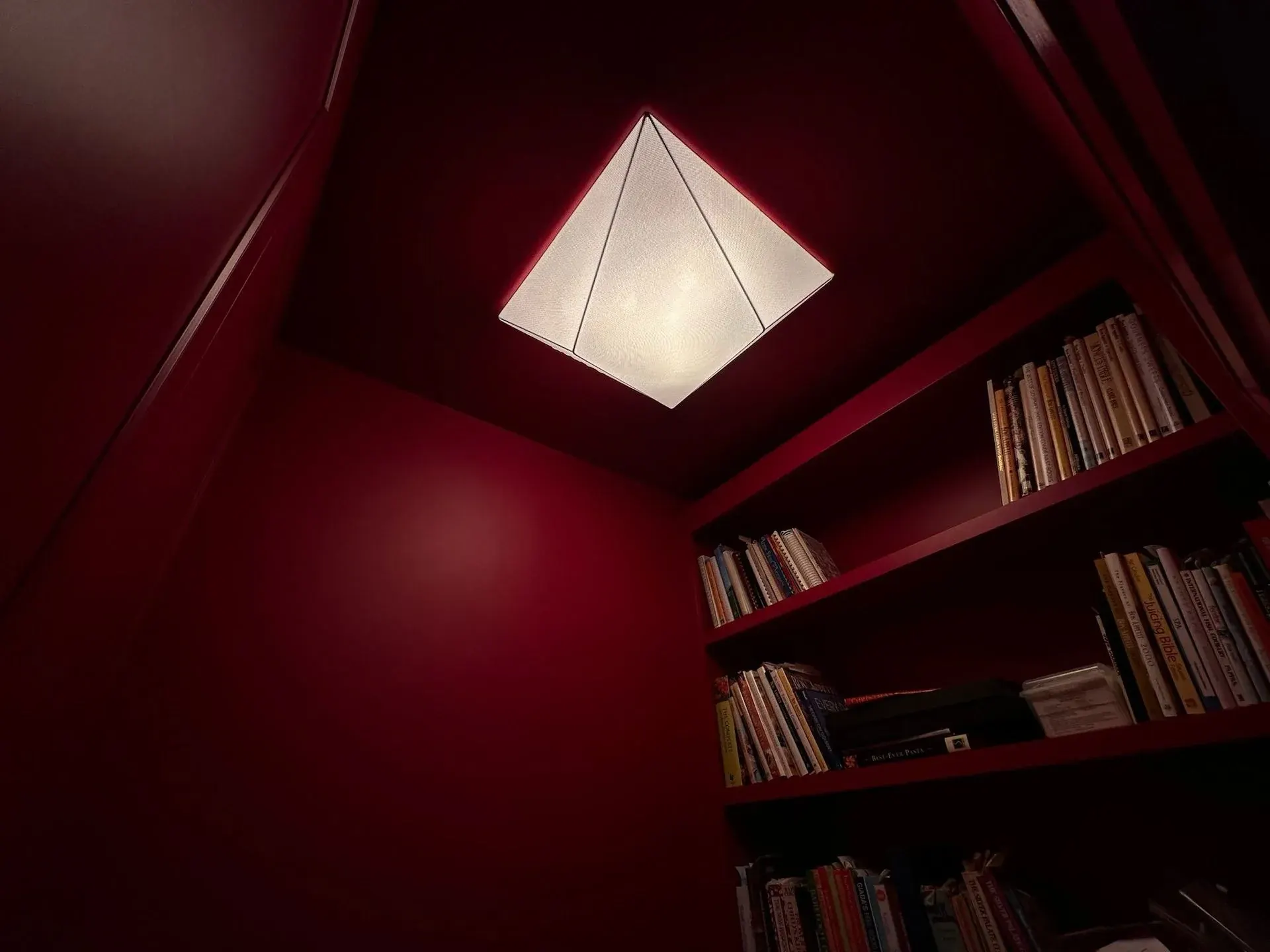 Red library with a pyramid ceiling fixture